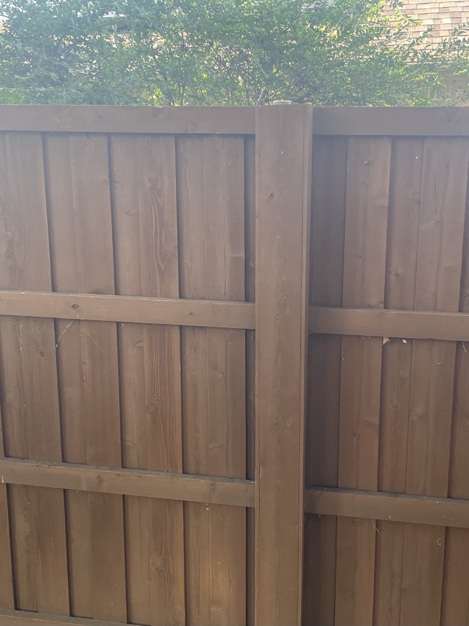 Cedar wood box covering a steel fence post for a clean finished look